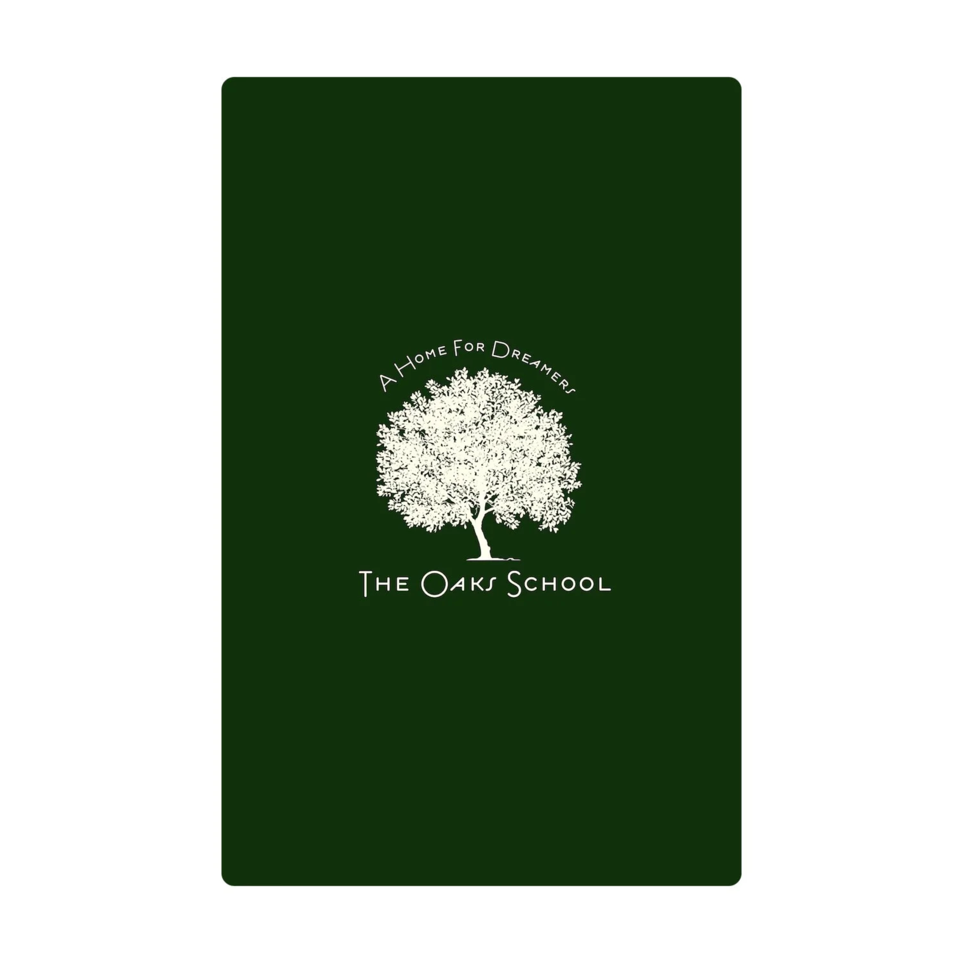 Dark green blanket with white tree logo and text on a white background