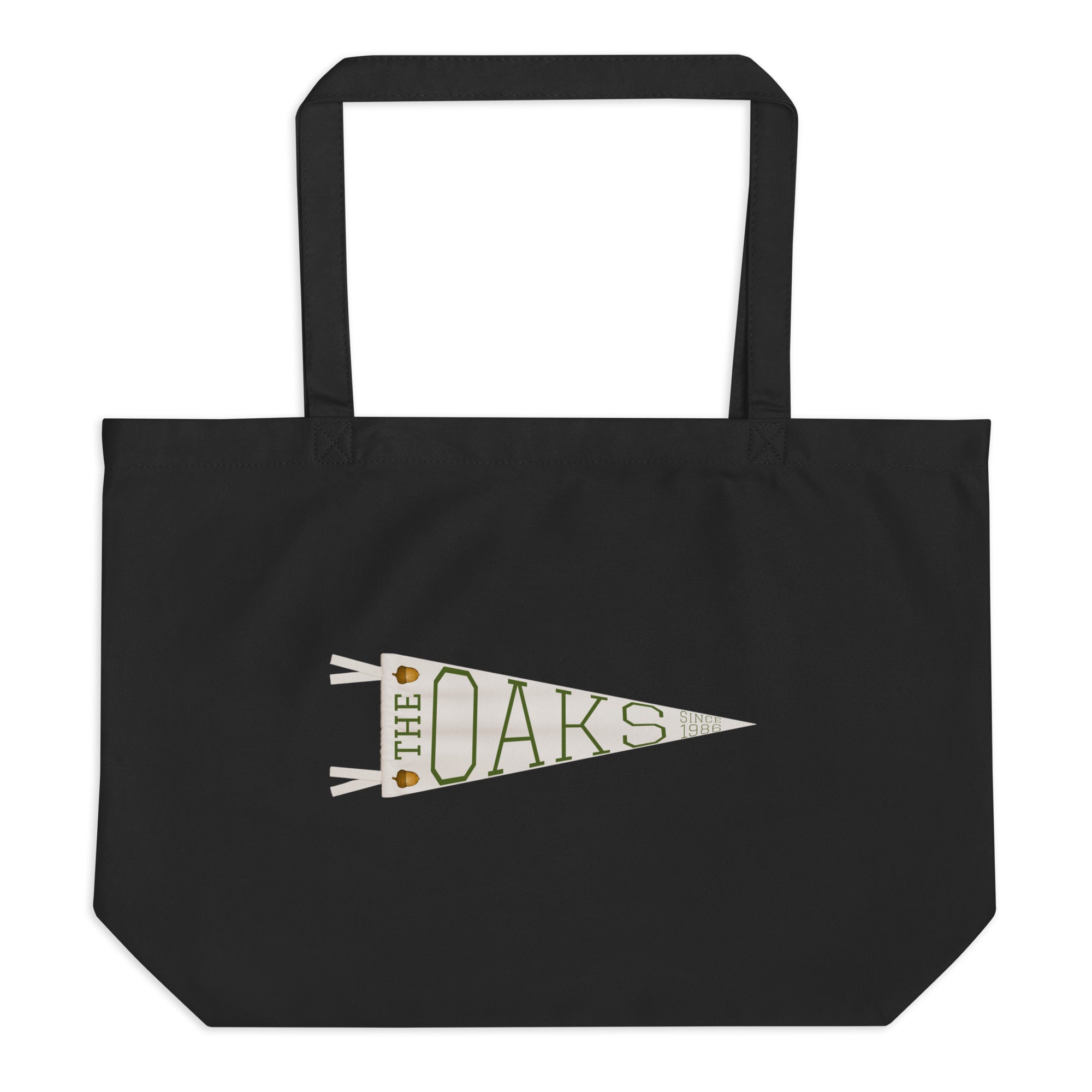 Product mockup: A black canvas bag on a white background featuring a pennant that says "The Oaks Since 1986" and two acorns