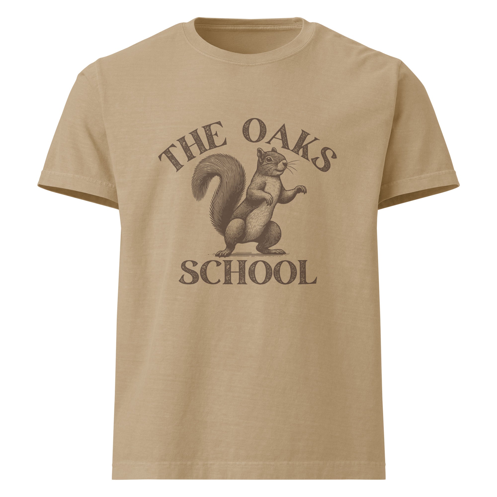 Product mockup: A khaki colored tshirt on a white background featuring an illustration of a squirrel with text surrounding it that says "The Oaks School"