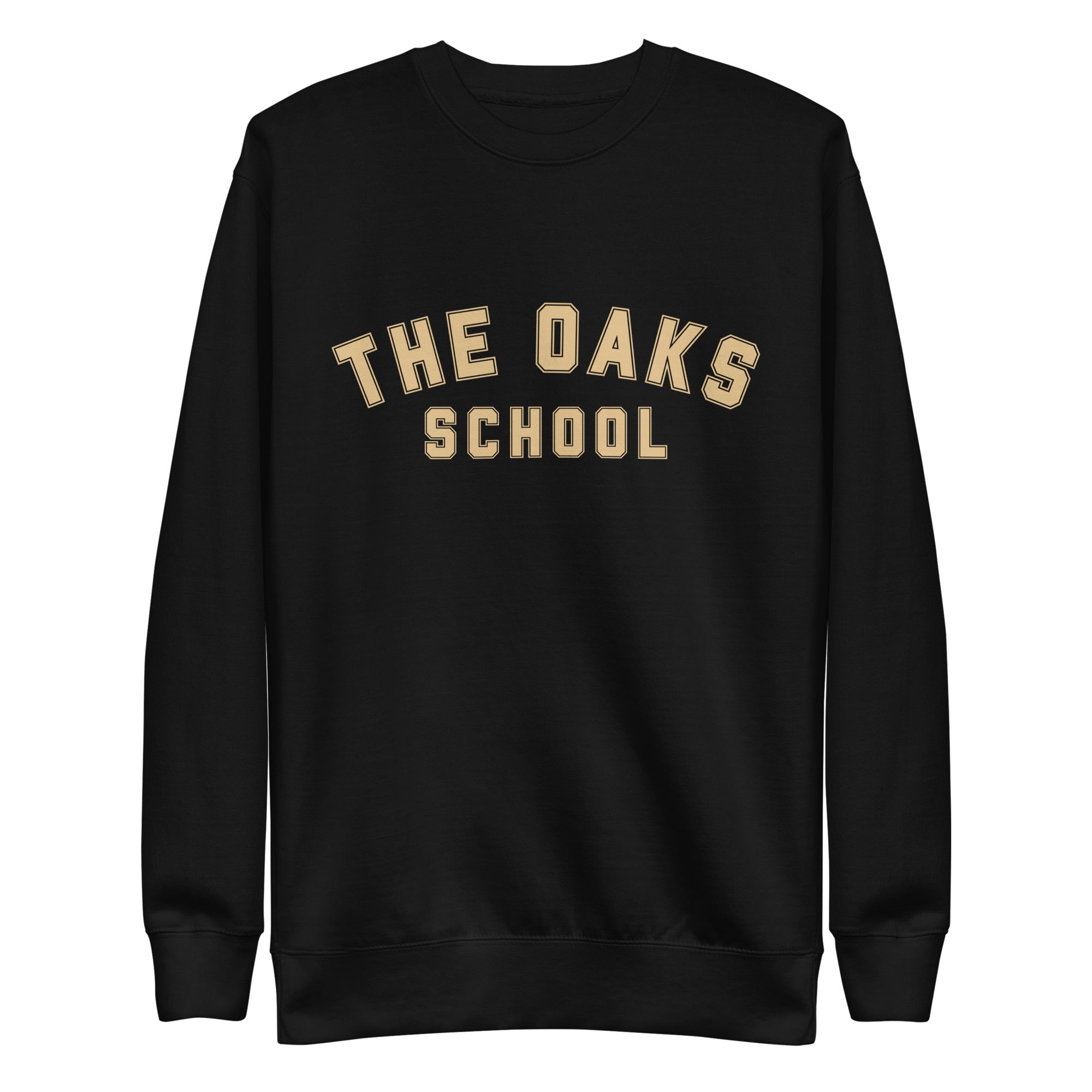 Product mockup: A black sweatshirt on a white background with cream colored collegiate style lettering that says "The Oaks School"