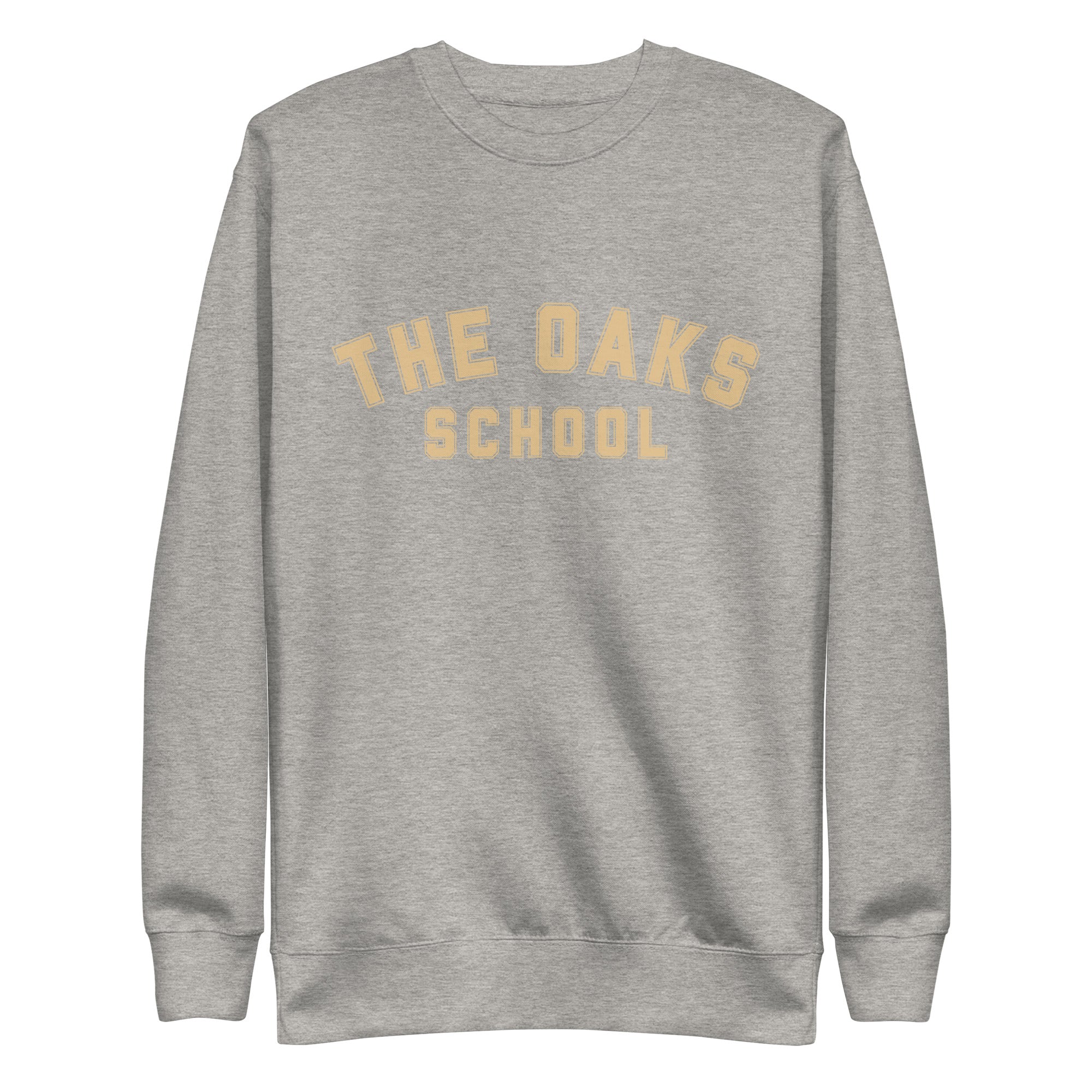 Product mockup: A carbon gray colored sweatshirt on a white background with cream colored collegiate style lettering that says "The Oaks School"