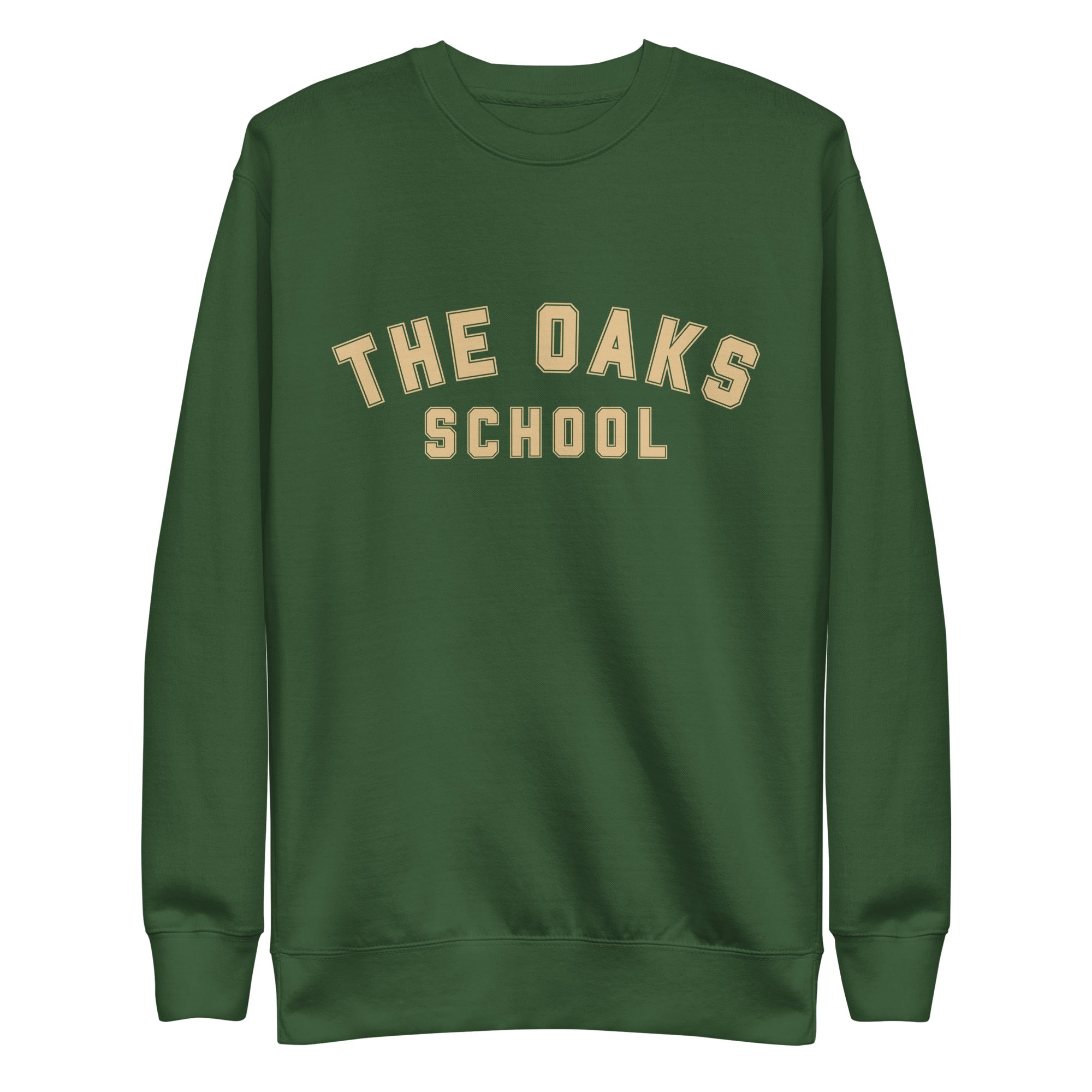 Product mockup: A forest green sweatshirt on a white background with cream colored collegiate style lettering that says "The Oaks School"