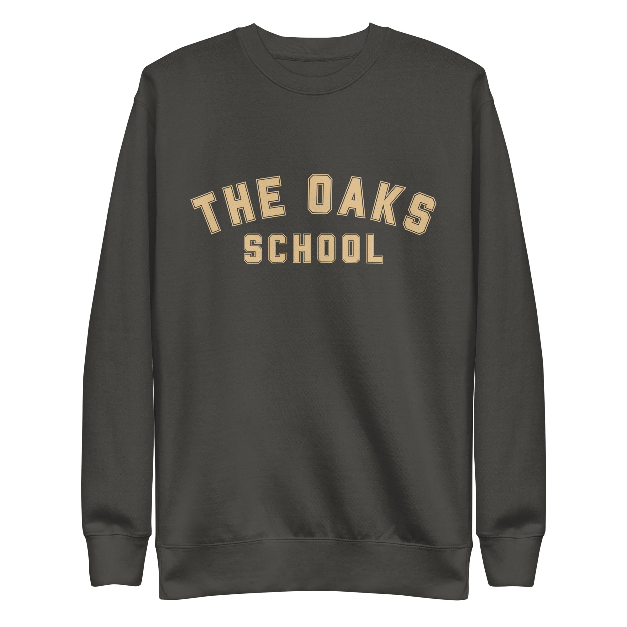 Product mockup: A vintage black sweatshirt on a white background with cream colored collegiate style lettering that says "The Oaks School"