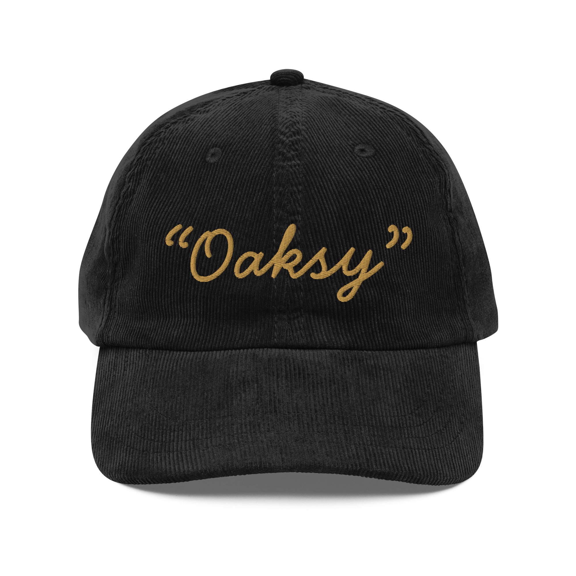 Product mockup:  A black corduroy cap on a white background featuring gold lettering in a handwriting font that says "Oaksy" in quotes