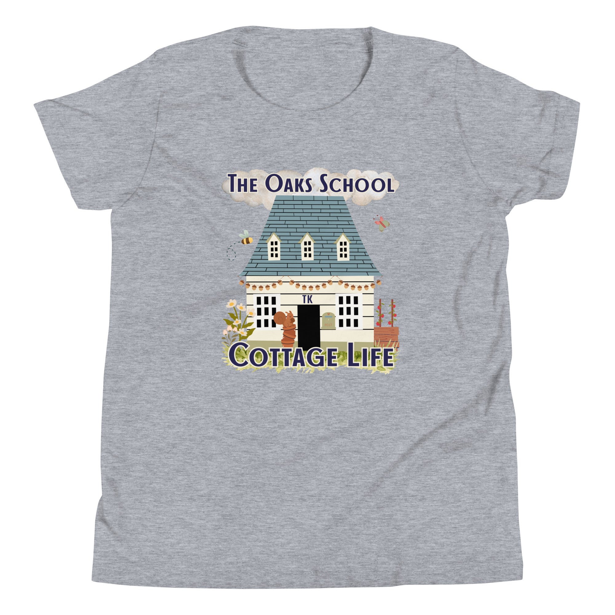 Product mockup: A heather gray tshirt on a white background featuring an illustration of a white cottage and the text "The Oaks School" and "Cottage Life"
