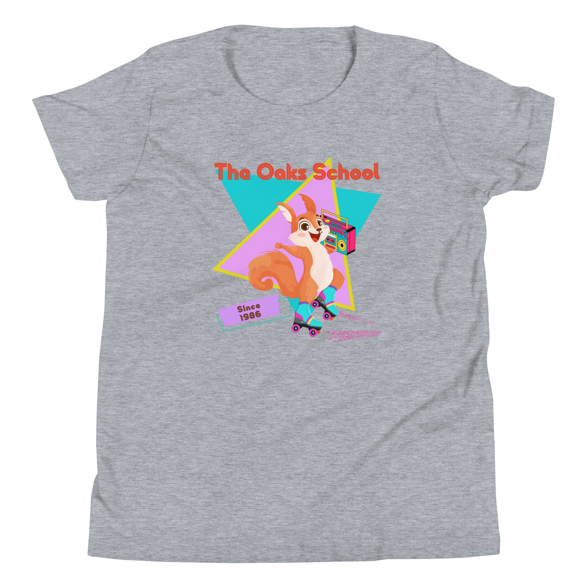 Product mockup: Heather gray tshirt on white background featuring a squirrel with roller skates holding a boombox and text that reads "The Oaks School" and "Since 1986"