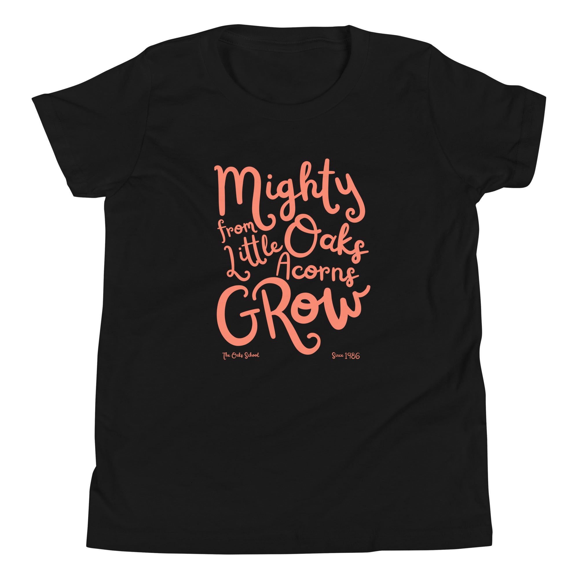 Product mockup: A black tshirt on a white background with orange script text that says "Mighty Oaks from Little Acorns Grow" and "The Oaks School Since 1986"