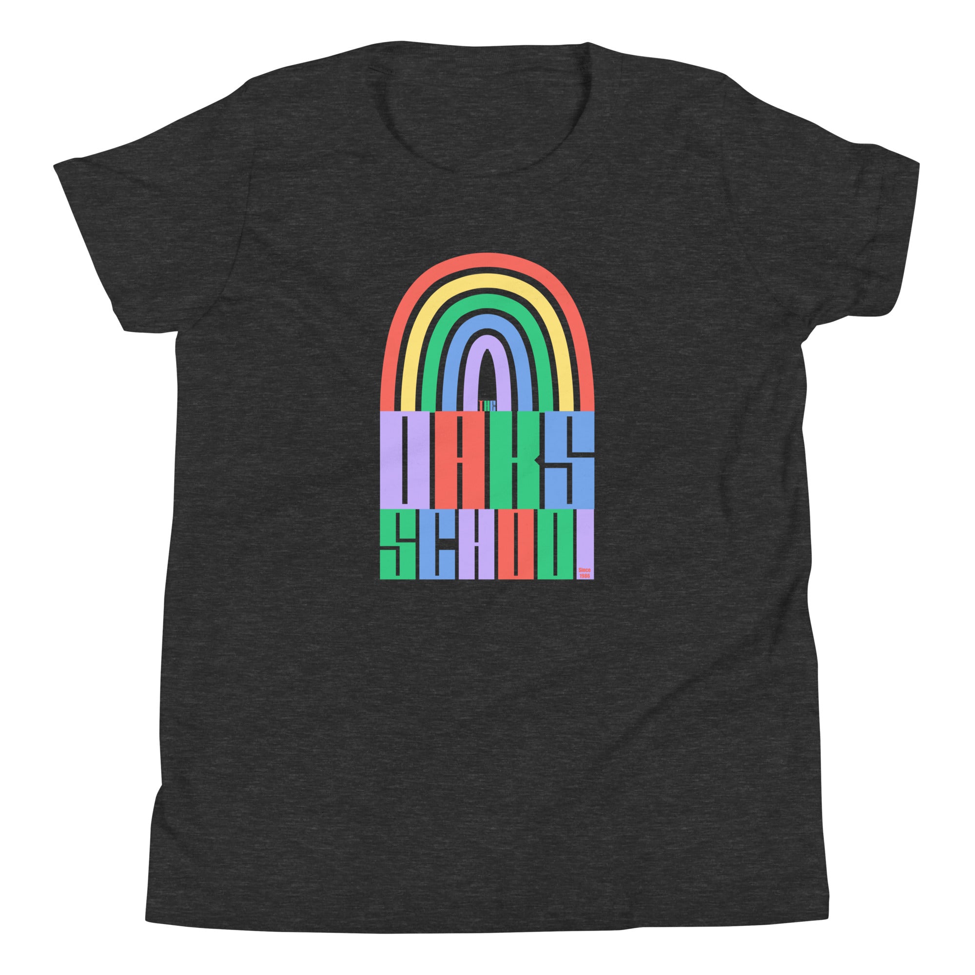 Product mockup: A dark gray heather tshirt on a white background featuring a rainbow illustration flowing into rainbow colored block letters that say "The Oaks School"