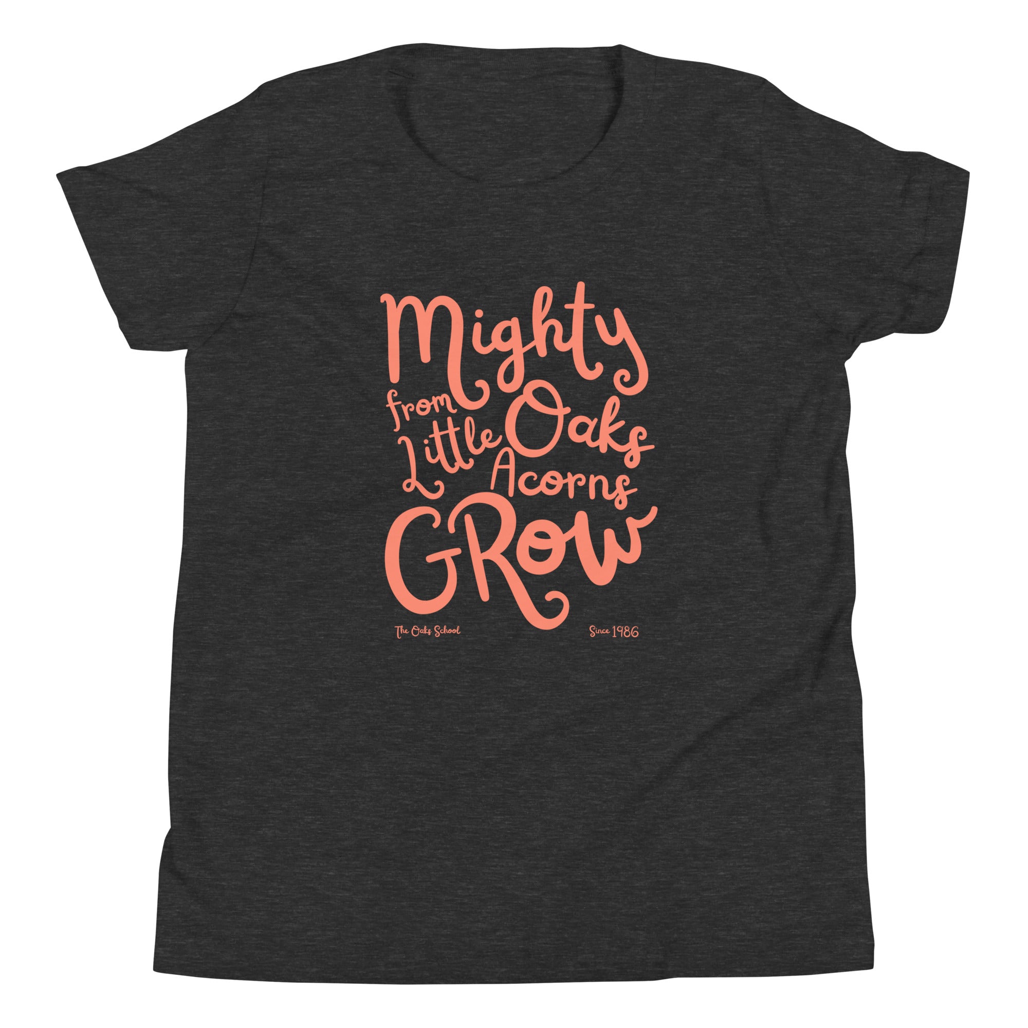 Product mockup: A dark gray heather tshirt on a white background with orange script text that says "Mighty Oaks from Little Acorns Grow" and "The Oaks School Since 1986"