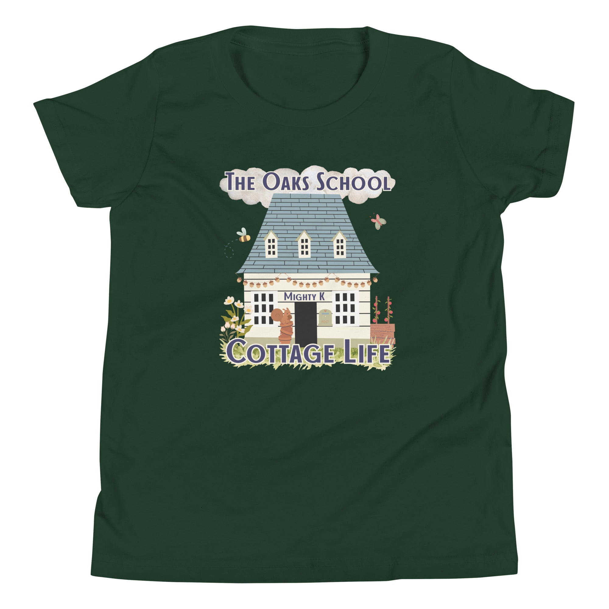 Product mockup: A forest green tshirt on a white background featuring an illustration of a white cottage and the text "The Oaks School" and "Cottage Life"