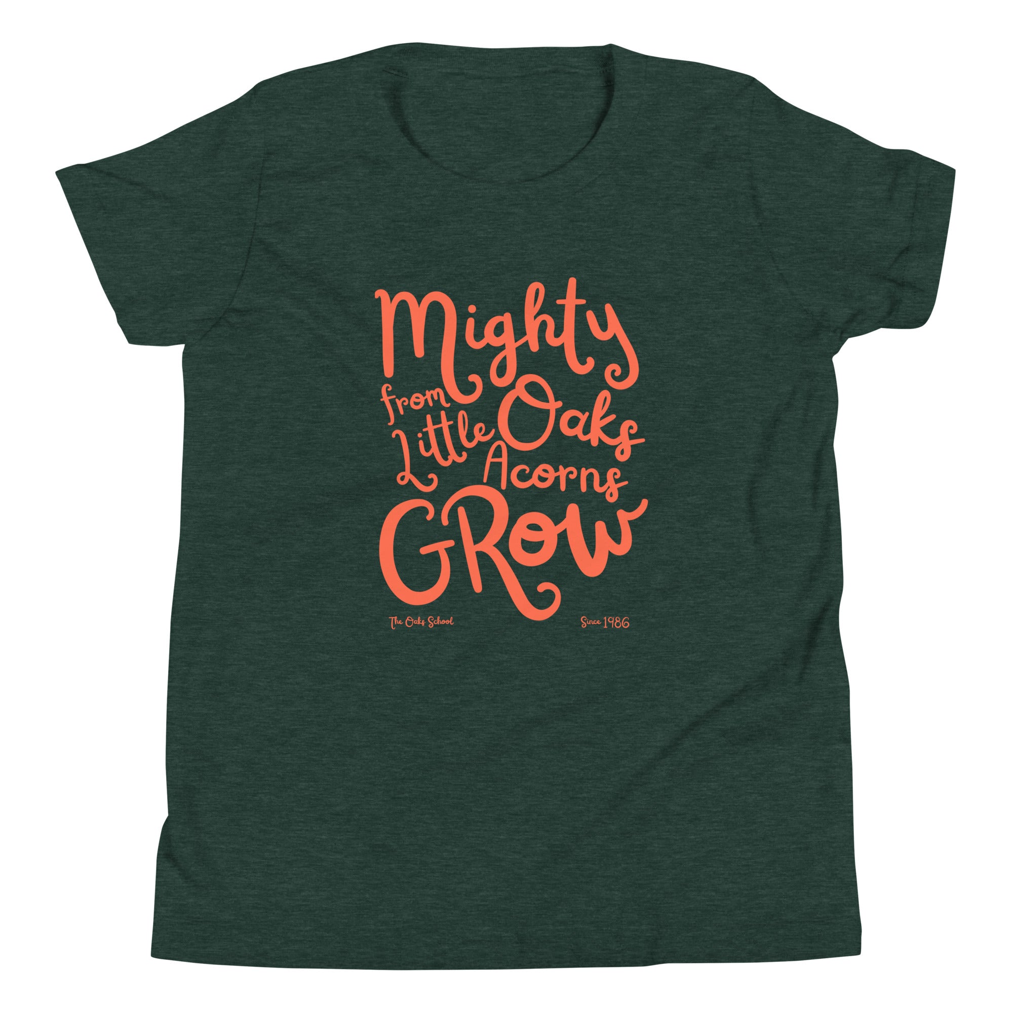 Product mockup: A heather forest colored tshirt on a white background with orange script text that says "Mighty Oaks from Little Acorns Grow" and "The Oaks School Since 1986"