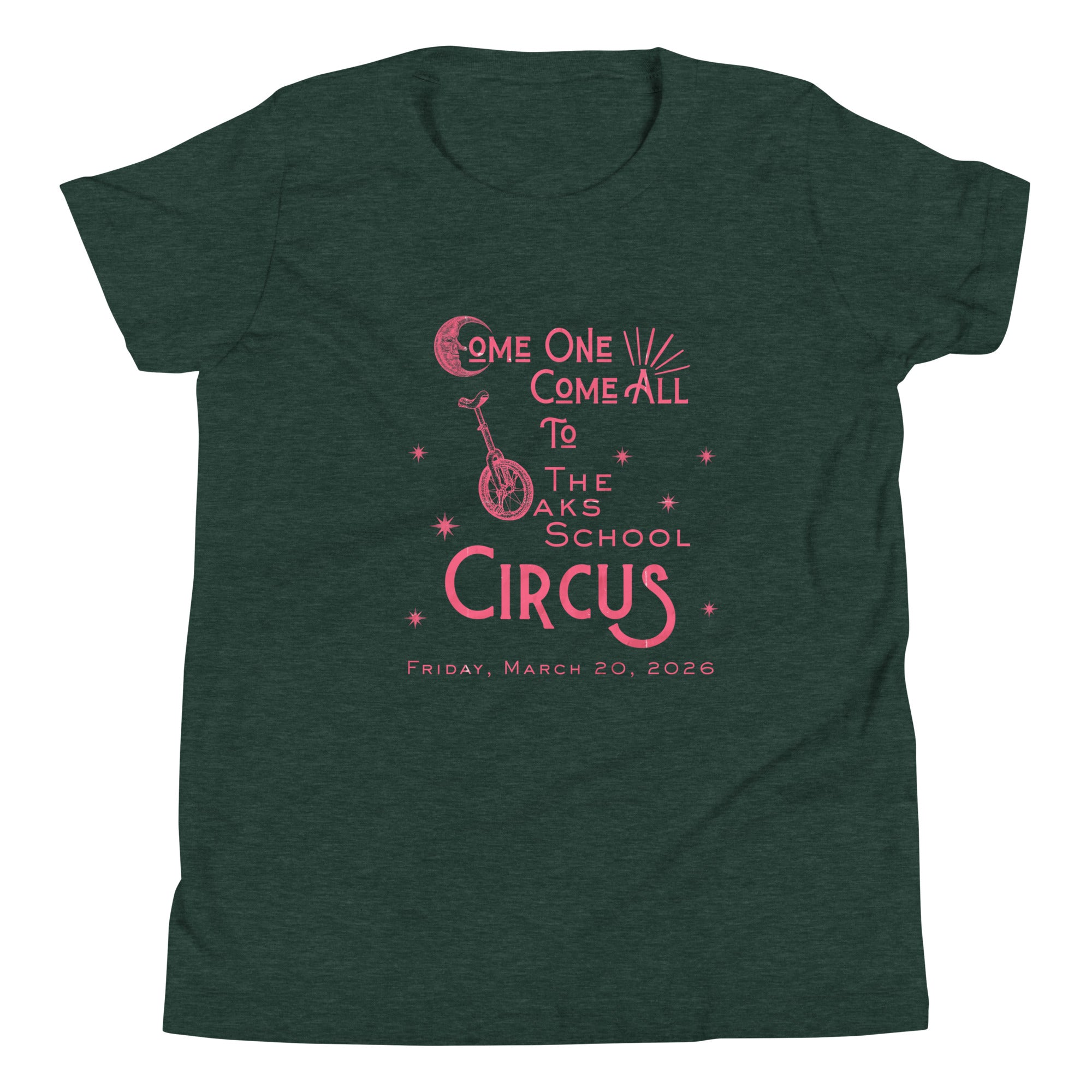 Product mockup: Heather forest tee with pink, weathered text "Come one, Call All to The Oaks School Circus, Friday, March 20, 2026." The "O" in "Oaks" is a unicycle wheel, the "C" in the first "Come" is a crescent moon, and there are stars sprinkled throughout.