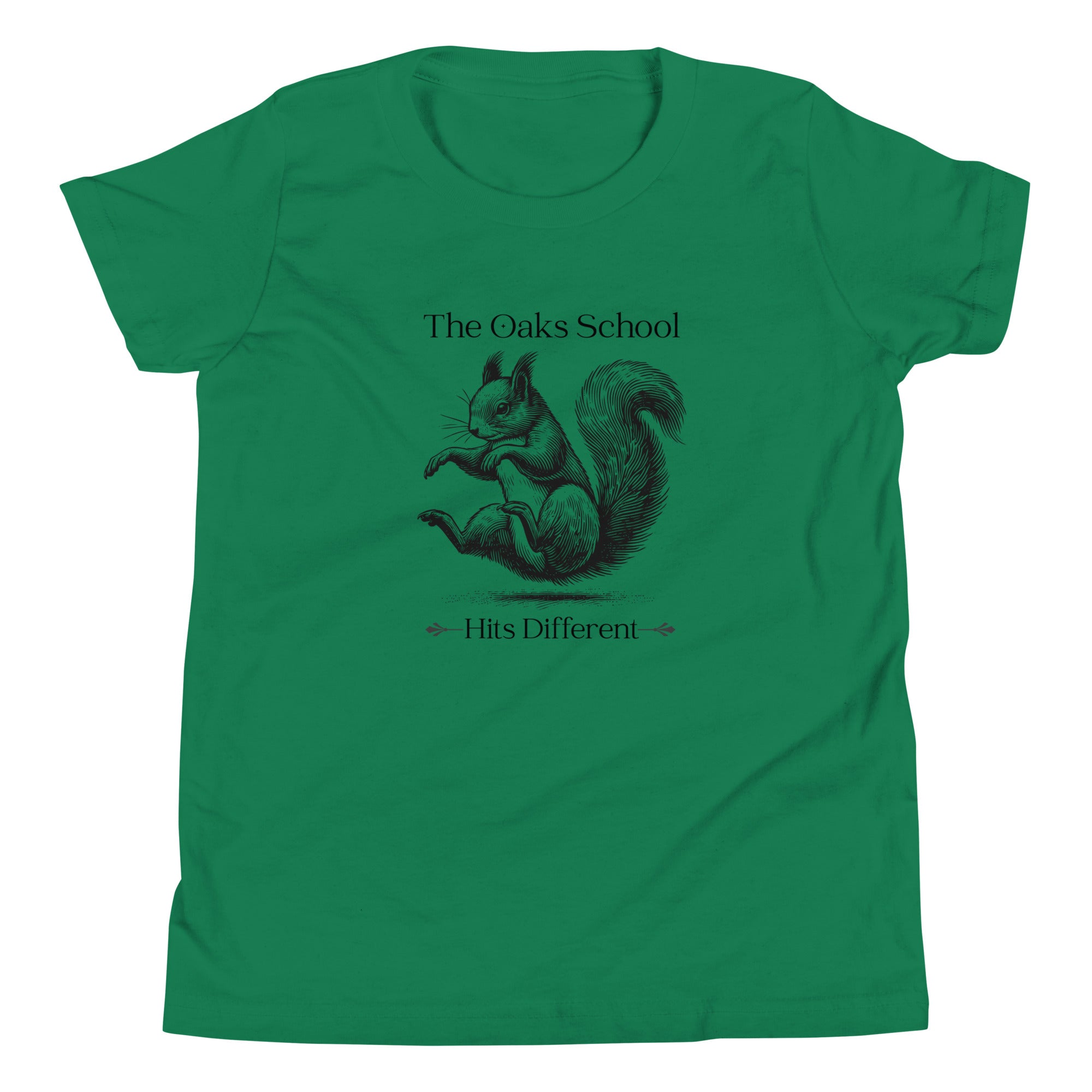 Product mockup: A kelly green tshirt on a white background featuring an illustration of a squirrel landing on its bottom and the text "The Oaks School" and "Hits Different"
