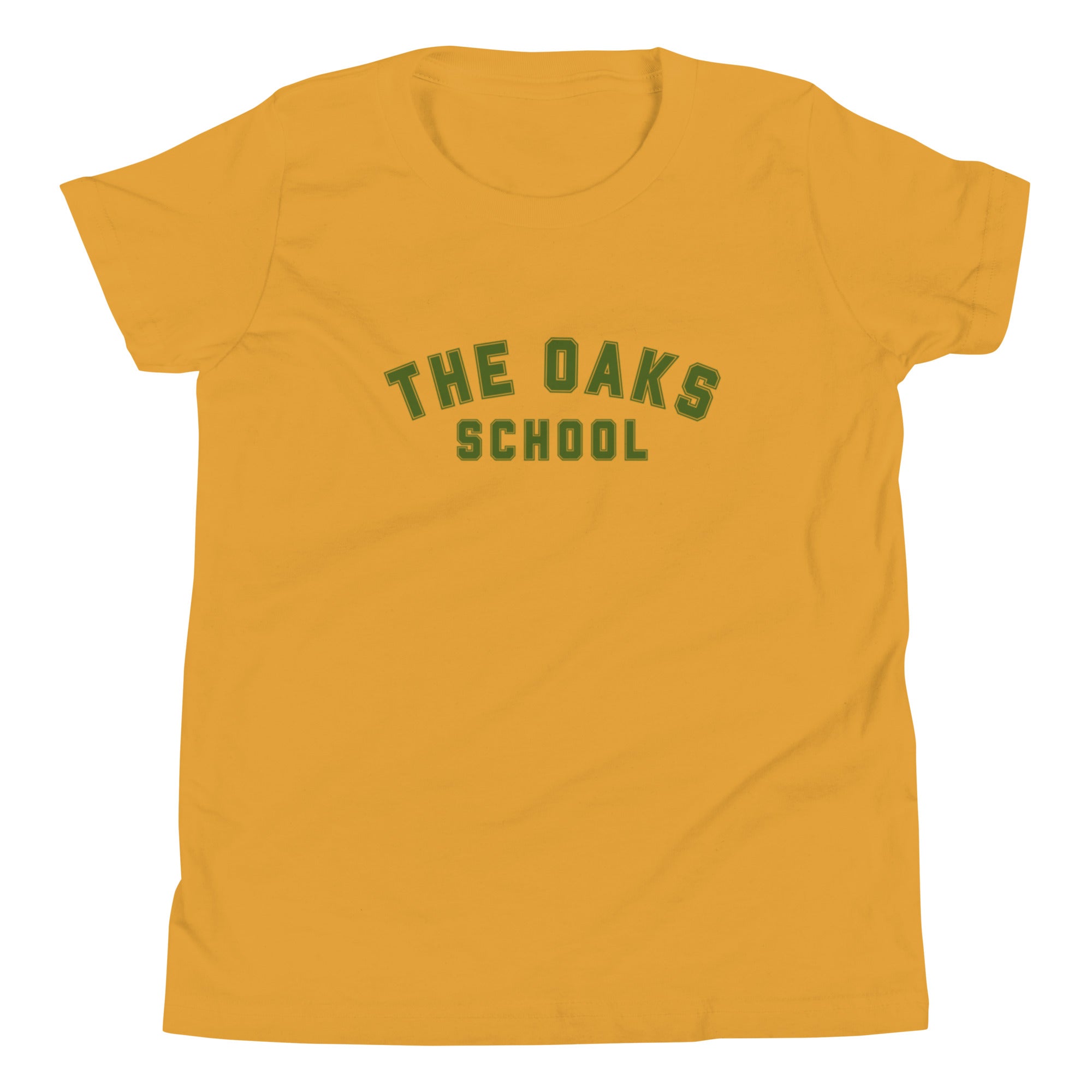Product mockup: A mustard yellow tshirt on a white background featuring green collegiate style lettering that says "The Oaks School"