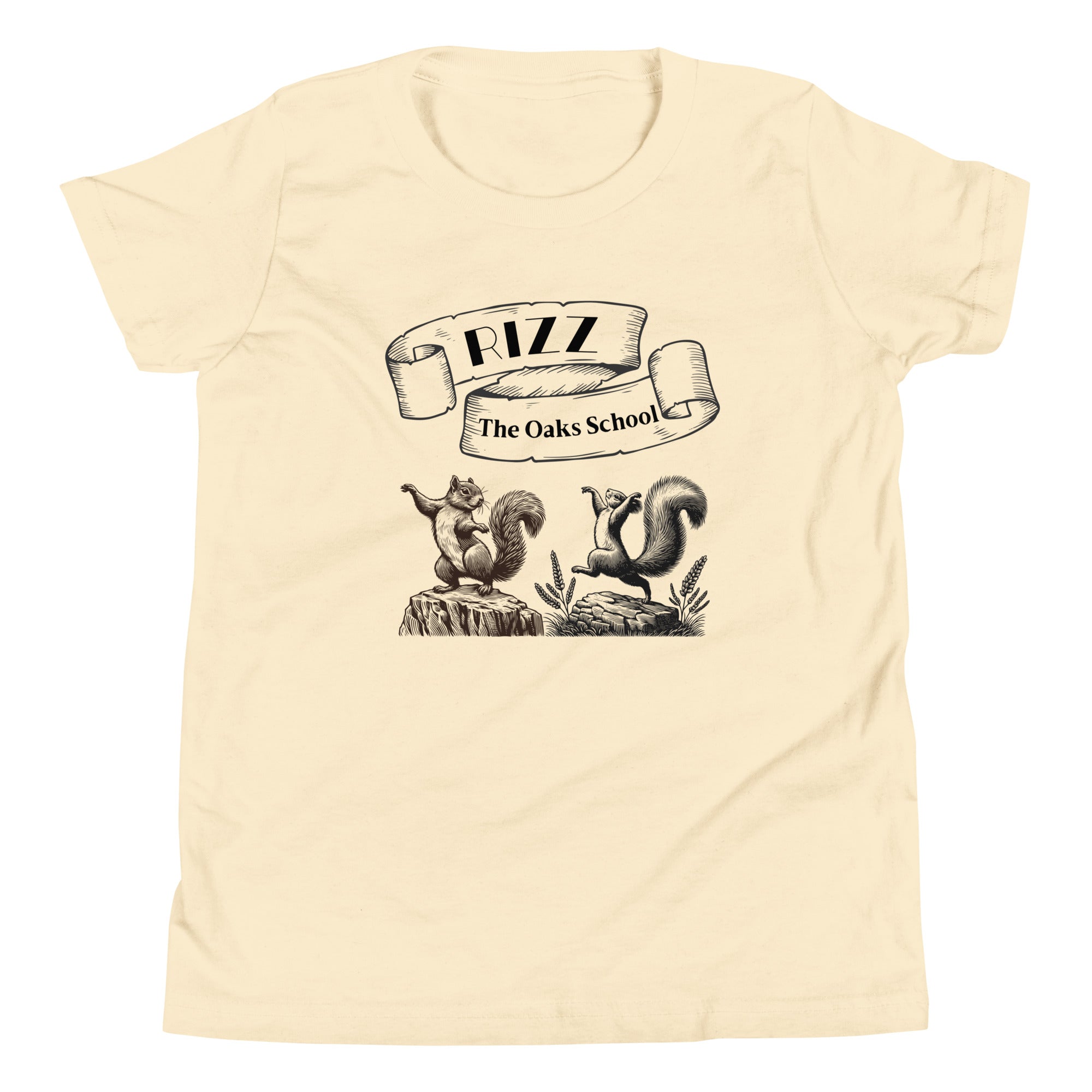 Product mockup: A natural colored tshirt on a white background featuring an illustration of two squirrels dancing on stumps with a scroll above them with the text "Rizz" and "The Oaks School."