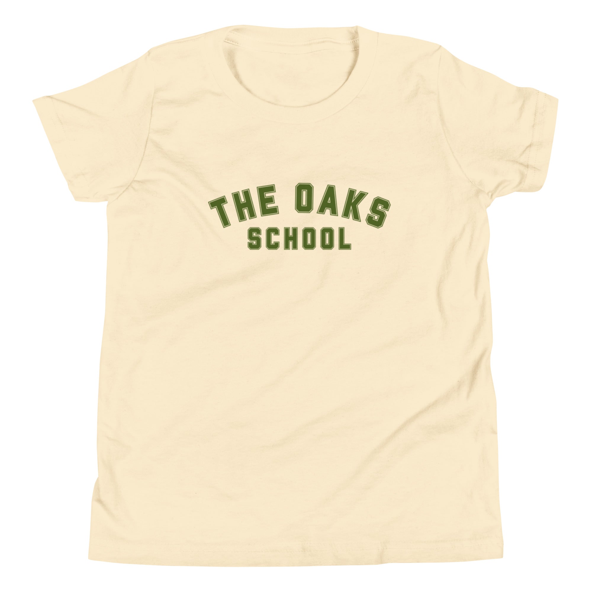 Product mockup: A natural colored tshirt on a white background featuring green collegiate style lettering that says "The Oaks School"
