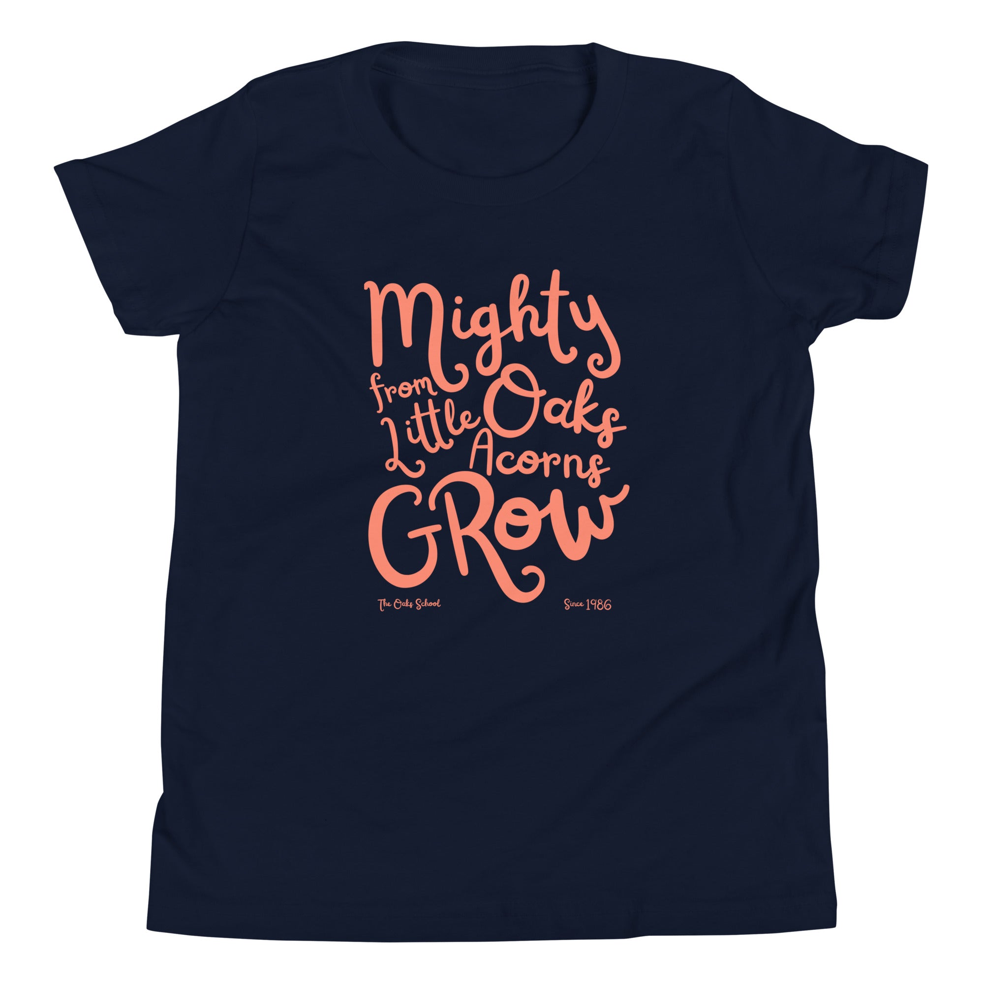 Product mockup: A navy tshirt on a white background with orange script text that says "Mighty Oaks from Little Acorns Grow" and "The Oaks School Since 1986"