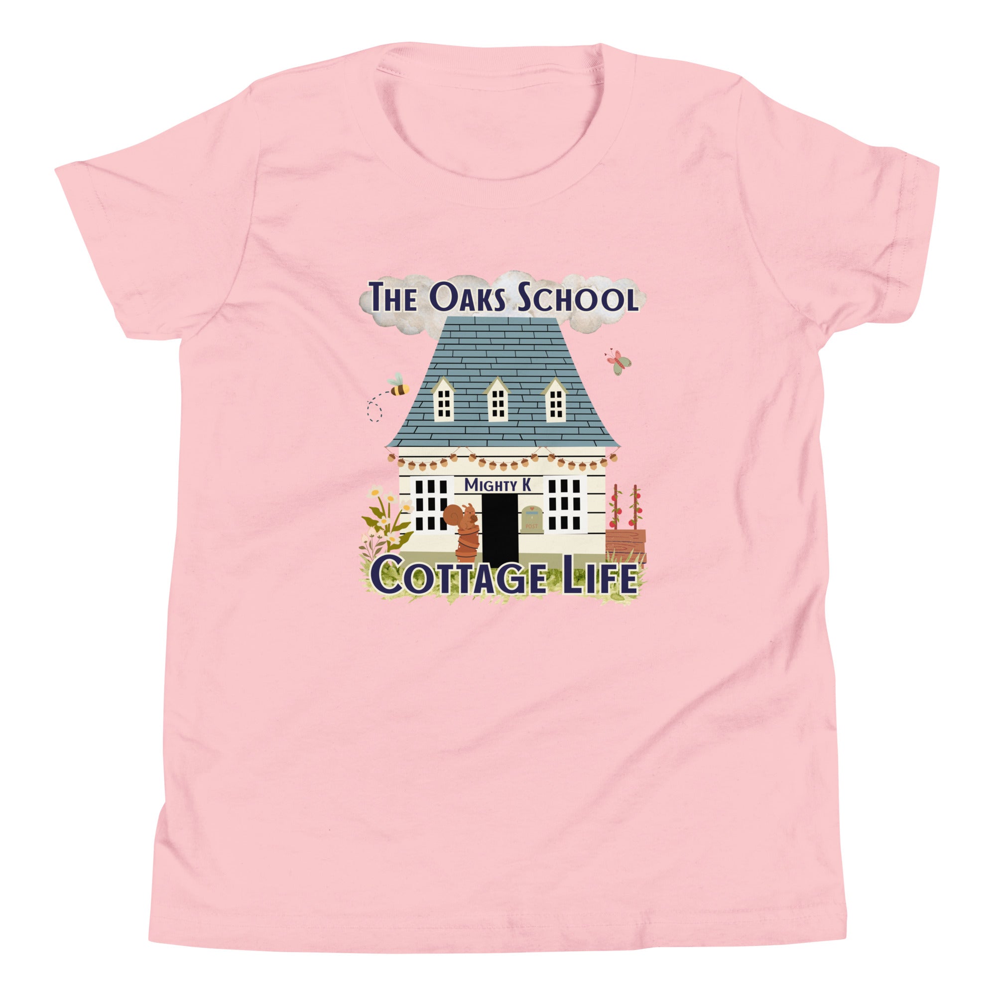 Product mockup: A pink tshirt on a white background featuring an illustration of a white cottage and the text "The Oaks School" and "Cottage Life"