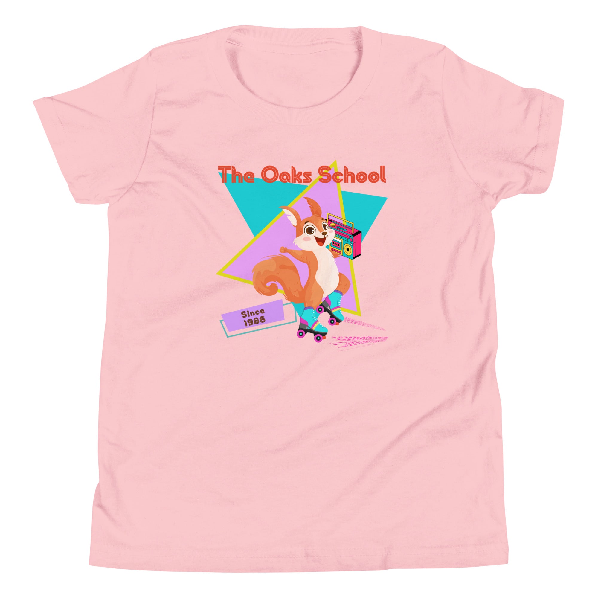 Product mockup: Pink tshirt on white background featuring a squirrel with roller skates holding a boombox and text that reads "The Oaks School" and "Since 1986"