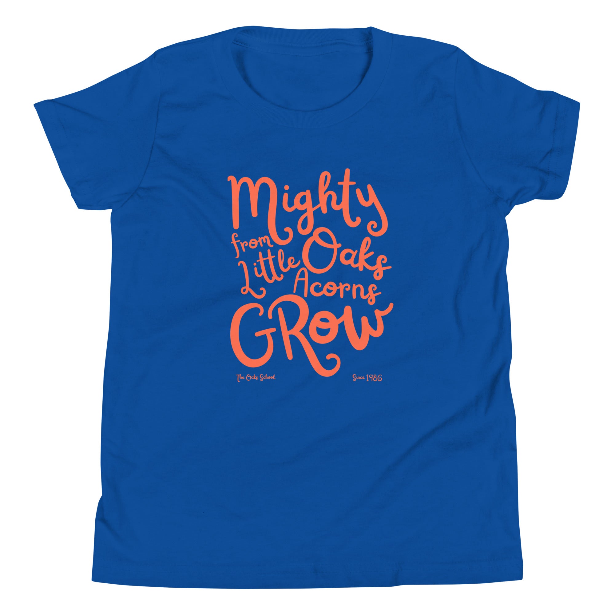 Product mockup: A royal blue tshirt on a white background with orange script text that says "Mighty Oaks from Little Acorns Grow" and "The Oaks School Since 1986"
