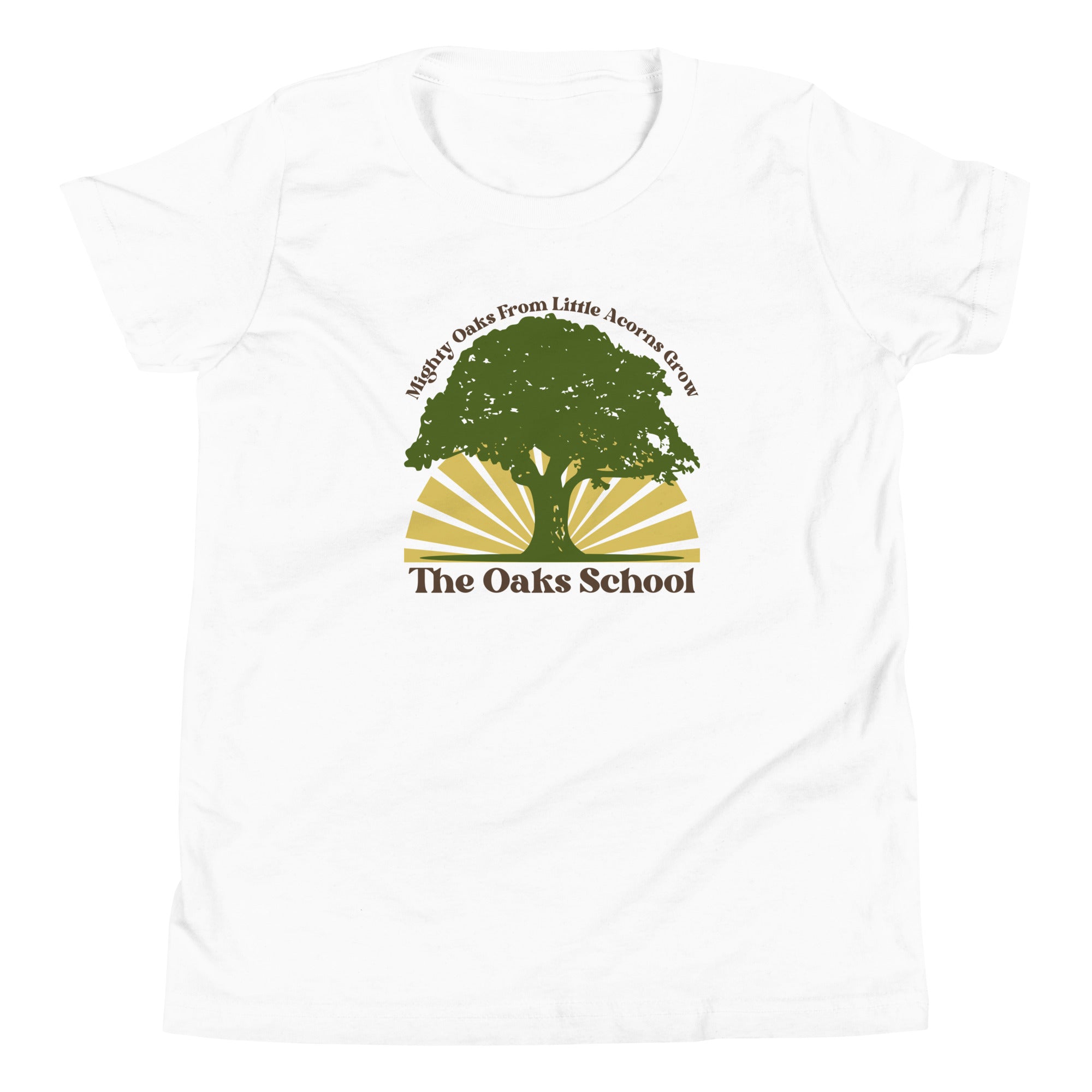 Product mockup: A white tshirt on a white background featuring a green oak tree illustration on a yellow sunburst with text that says "Mighty Oaks from Little Acorns Grow" and "The Oaks School"